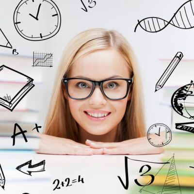 education and school concept - smiling student with stack of books and doodles