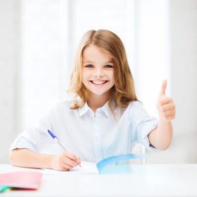 education and school concept - smiling student girl studying at school